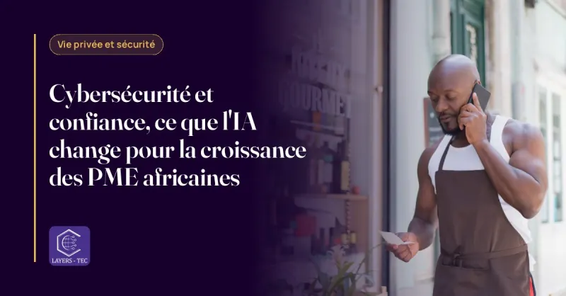 Une commerçante africaine consulte son téléphone derrière le comptoir de sa boutique.
